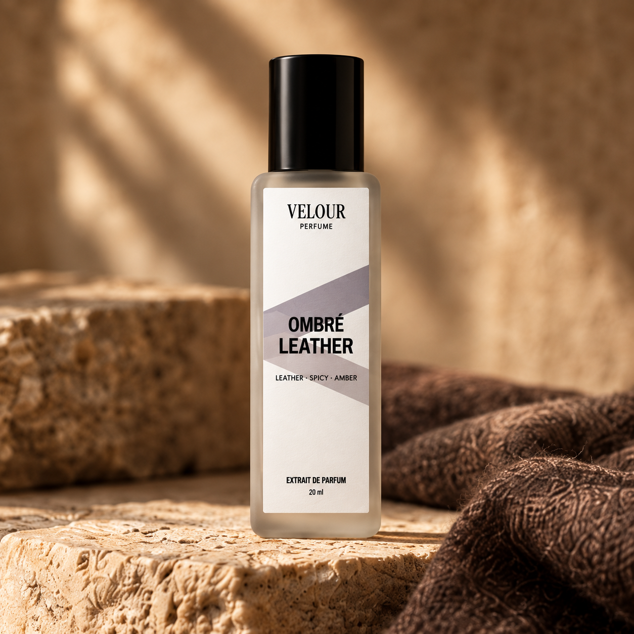 Ombré Leather by Velour Perfume, 20ml Extrait de Parfum bottle on warm stone